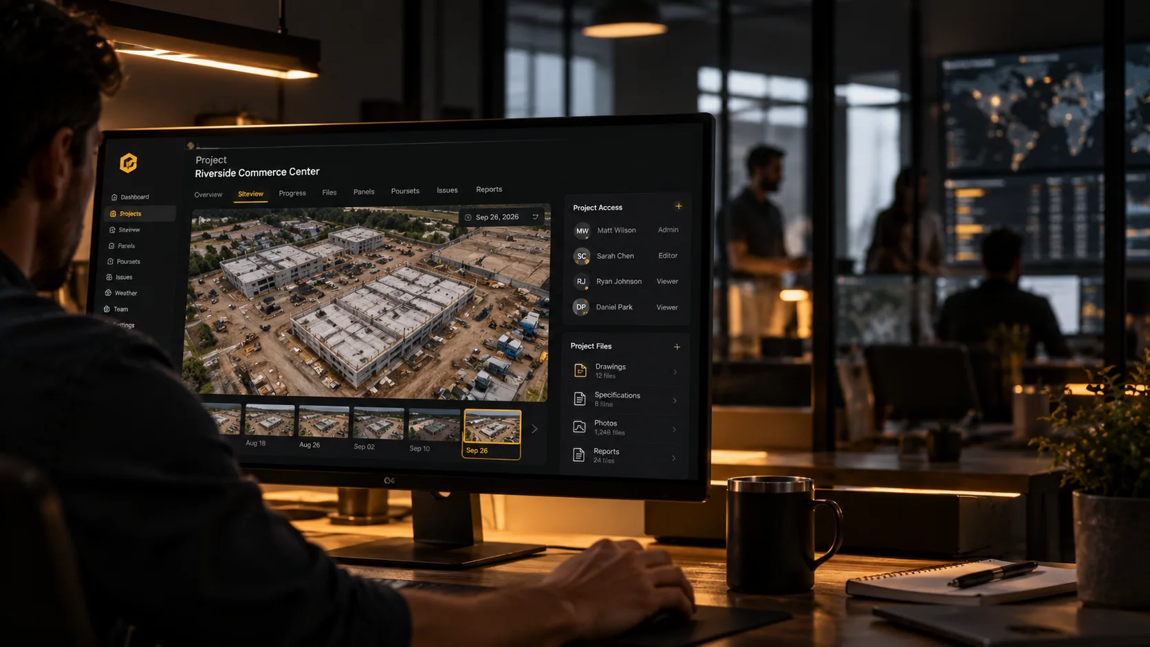 A project engineer reviews the Riverside Commerce Center project in SkyMul on a desktop monitor